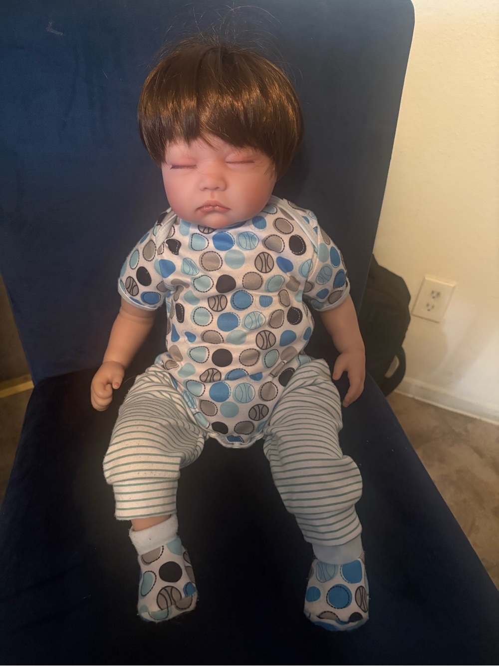 Realistic baby doll wearing Baby Blue Polka One-Piece Romper for Kids
